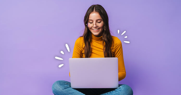 2023/04/Woman-laptop-purple-computer-website-glasses-min.jpg